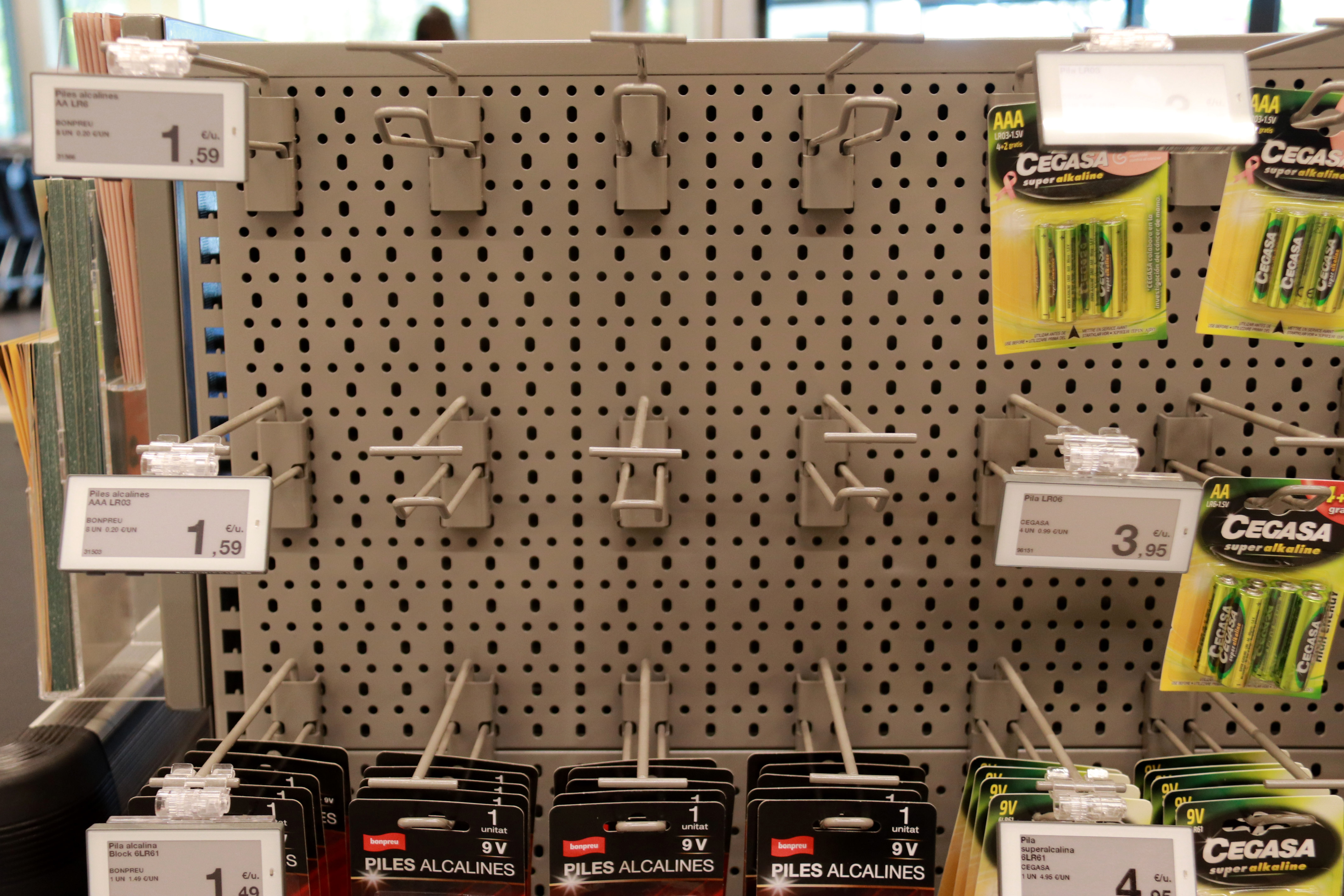 Half-empty battery display rack at an Esclat supermarket the day after the power outage.